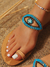 Slip-On-Sandalen mit bösem Blick